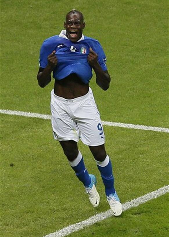 Italy's Mario Balotelli celebrates scoring the opening goal during the Euro 2012 soccer championship semifinal match between Germany and Italy in Warsaw, Poland, Thursday, June 28, 2012. 