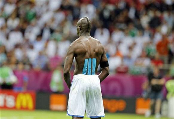 Italy's Mario Balotelli celebrates his second goal during the Euro 2012 soccer championship semifinal match between Germany and Italy in Warsaw, Poland, Thursday, June 28, 2012.