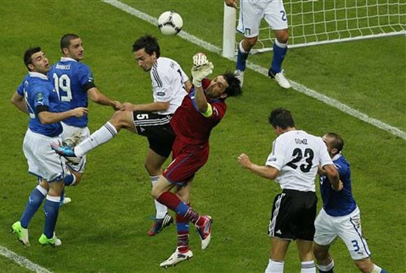 Italy goalkeeper Gianluigi Buffon deflects a ball during the Euro 2012 soccer championship semifinal match between Germany and Italy in Warsaw, Poland, Thursday, June 28, 2012.