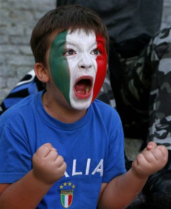 Italy young soccer fan reacts during the Euro 2012 soccer championship semifinal match between Germany and Italy at a fan zone in Warsaw, Poland , Thursday, June 28, 2012. 