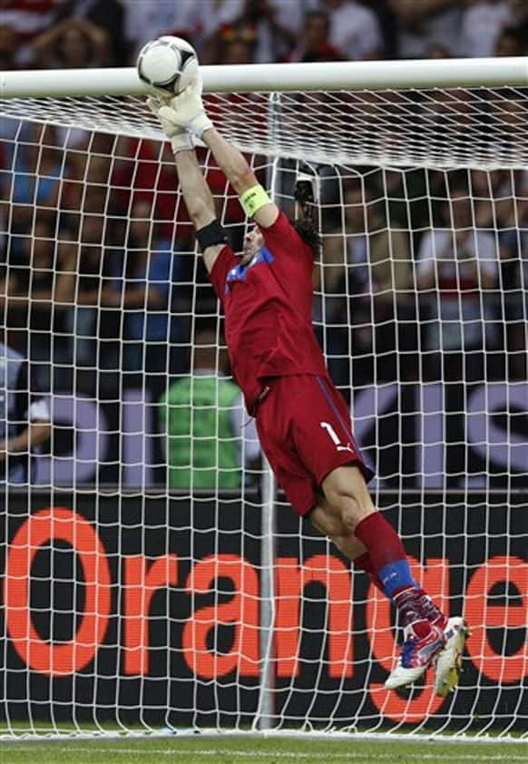 Italy goalkeeper Gianluigi Buffon makes a save during the Euro 2012 soccer championship semifinal match between Germany and Italy in Warsaw, Poland, Thursday, June 28, 2012.