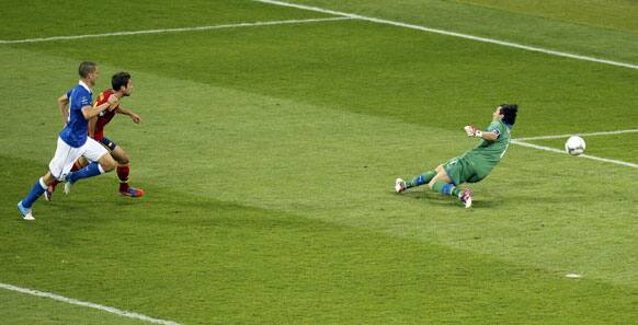 Spain's Jordi Alba, second left, scores his side's second goal past Italy goalkeeper Gianluigi Buffon, right during the Euro 2012 soccer championship final between Spain and Italy in Kiev, Ukraine, Sunday, July 1, 2012