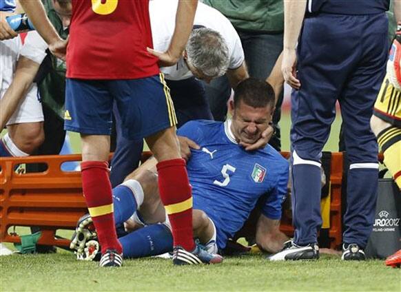 Italy's Thiago Motta receives assistance during the Euro 2012 soccer championship final between Spain and Italy in Kiev, Ukraine, Sunday, July 1, 2012.