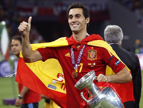 Spain's Alvaro Arbeloa holds the trophy at the end of the Euro 2012 soccer championship final between Spain and Italy in Kiev, Ukraine.