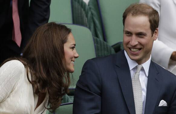 Britain's Prince William and Kate, Duchess of Cambridge watch Roger Federer of Switzerland play Mikhail Youzhny of Russia during a quarterfinals match at the All England Lawn Tennis Championships at Wimbledon.