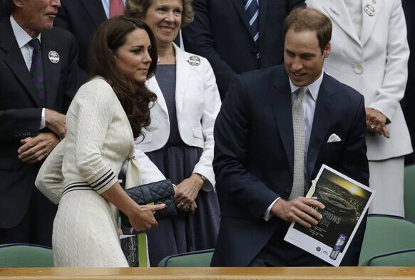 Britain's Prince William and his wife Kate, Duchess of Cambridge during the quarterfinals match between Roger Federer of Switzerland and Mikhail Youzhny of Russia at the All England Lawn Tennis Championships at Wimbledon.