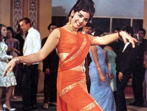 The orange saree worn by Mumtaz- in ‘Aaj kal tere mere pyar’ song in the 1968 film ‘Brahmachari’ -became an instant hit. The saree, draped in an unusual manner, became a new and stylish way of flaunting a thin frame. The style is still known by all and sundry as the ‘Mumtaz saree’. - Spice Team