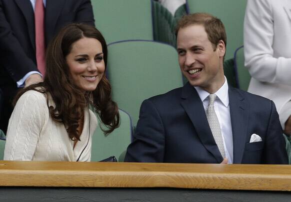 Britain's Prince William and Kate, Duchess of Cambridge watch Roger Federer of Switzerland play Mikhail Youzhny of Russia during a quarterfinals match at the All England Lawn Tennis Championships at Wimbledon.