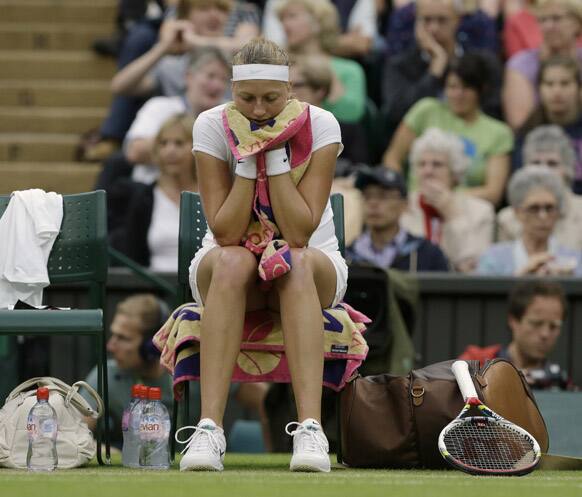 Petra Kvitova of the Czech Republic waits between sets during a quarterfinals match against Serena Williams of the United States at the All England Lawn Tennis Championships at Wimbledon.