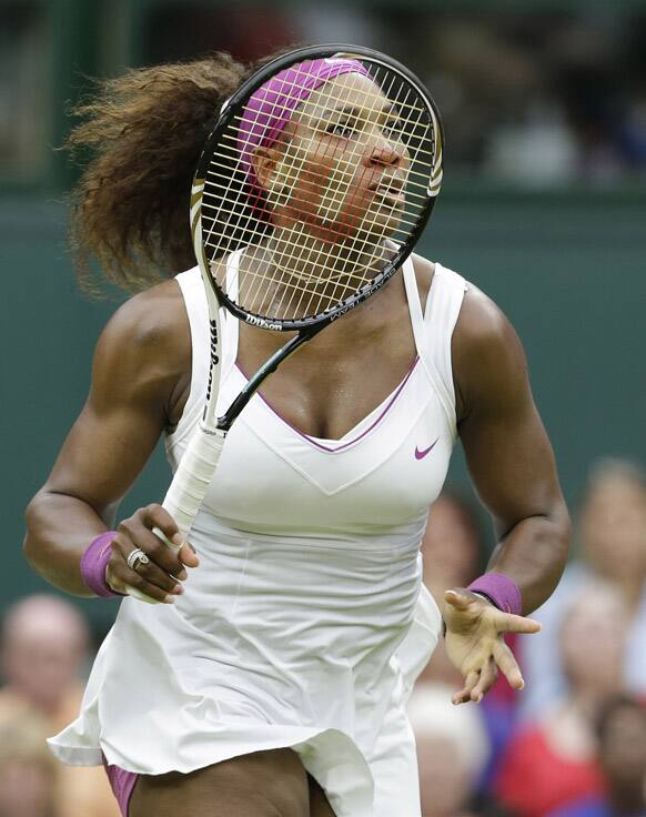 Serena Williams of the United States follows the ball during a quarterfinals match against Petra Kvitova of the Czech Republic at the All England Lawn Tennis Championships at Wimbledon.