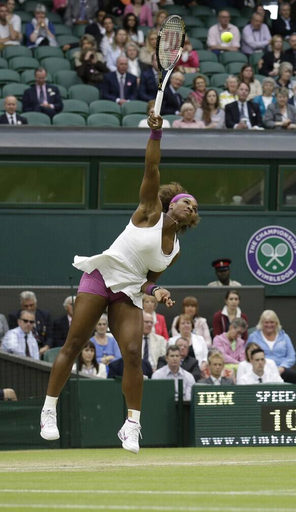 Serena Williams of the United States serves to Petra Kvitova of the Czech Republic during a quarterfinals match at the All England Lawn Tennis Championships at Wimbledon.