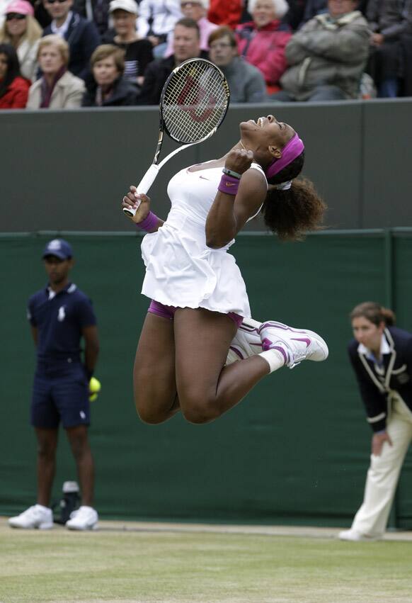 Serena Williams of the United States reacts after defeating Yaroslava Shvedova of Kazakhstan during a fourth round singles match at the All England Lawn Tennis Championships at Wimbledon.