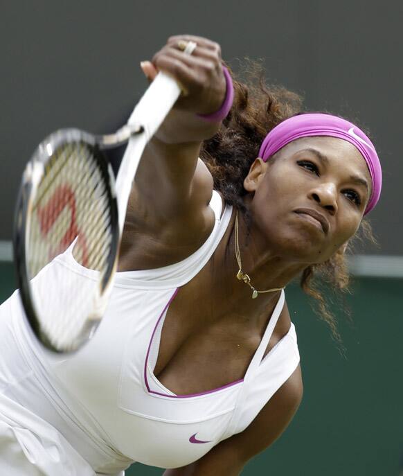 Serena Williams of the United States returns a shot to Barbora Zahlavova Strycova of the Czech Republic during a first round women's singles match at the All England Lawn Tennis Championships at Wimbledon.