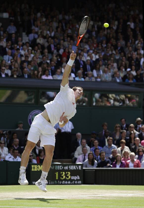 Andy Murray of Britain serves to Roger Federer of Switzerland during the men's final match at the All England Lawn Tennis Championships at Wimbledon, England, Sunday, July 8, 2012. 