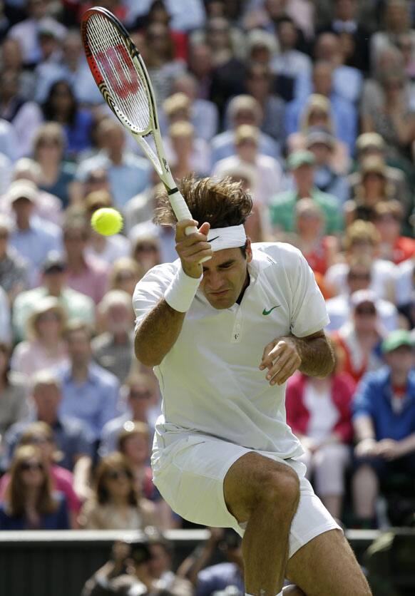 Roger Federer of Switzerland reacts during the men's final match against Andy Murray of Britain at the All England Lawn Tennis Championships at Wimbledon, England, Sunday, July 8, 2012. 