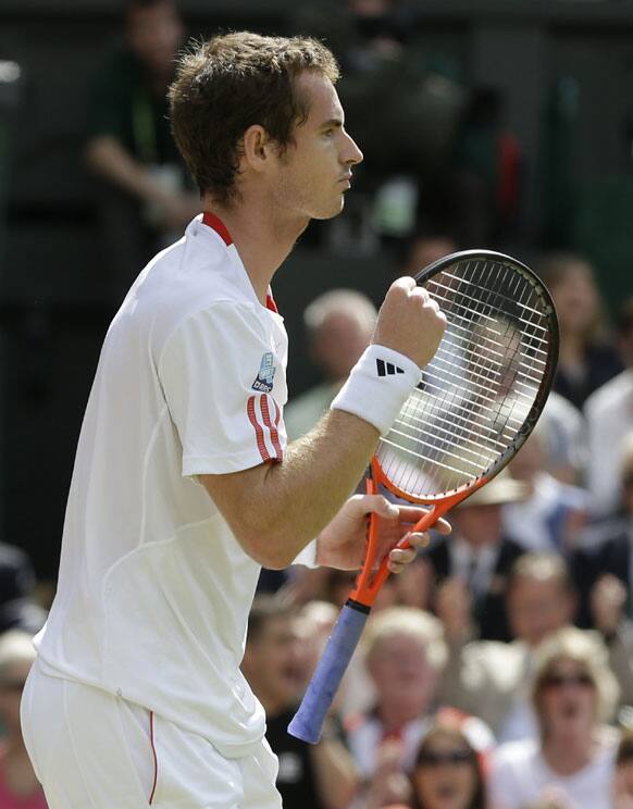 Andy Murray of Britain reacts during the men's final match against Roger Federer of Switzerland at the All England Lawn Tennis Championships at Wimbledon, England, Sunday, July 8, 2012