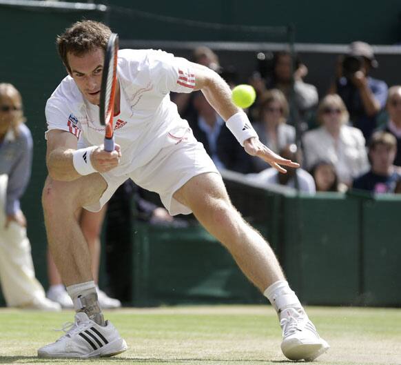 Andy Murray of Britain plays a shot to Roger Federer of Switzerland during the men's final match at the All England Lawn Tennis Championships at Wimbledon.