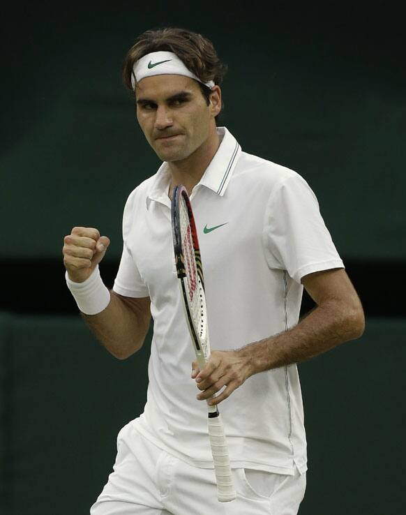 Roger Federer of Switzerland reacts during the men's singles final match against Andy Murray of Britain at the All England Lawn Tennis Championships at Wimbledon, England, Sunday, July 8, 2012.