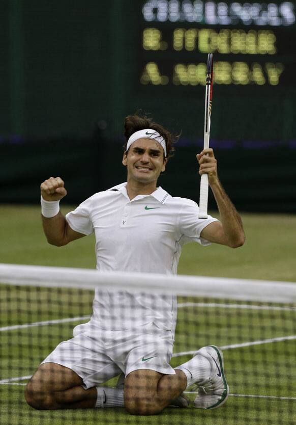 Roger Federer of Switzerland celebrates winning the men's singles final against Andy Murray of Britain at the All England Lawn Tennis Championships at Wimbledon, England, Sunday, July 8, 2012.