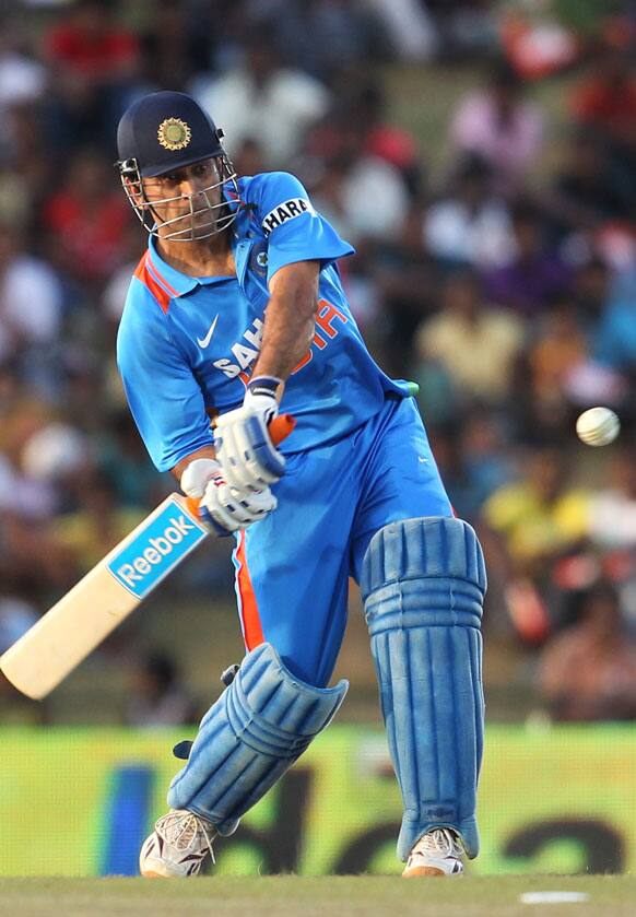 Mahendra Singh Dhoni bats during the first one-day international cricket match between Sri Lanka and India in Hambantota.