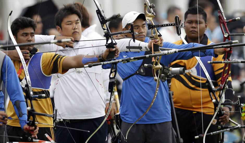 Archers from Malaysia, South Korea and Taiwan compete in the individual ranking round at the 2012 Summer Olympics in London.