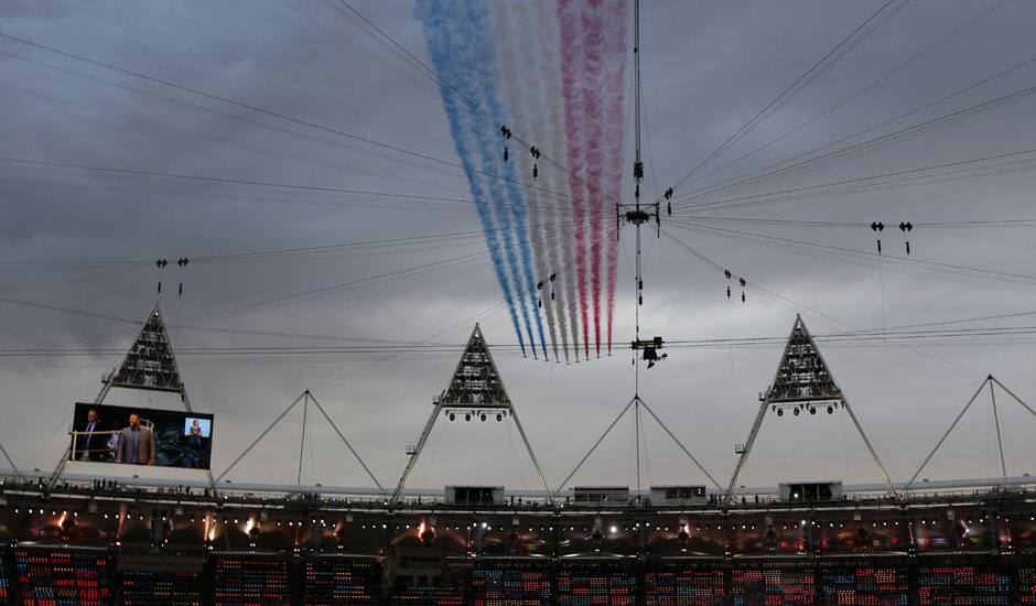 The Red Arrows flies over the stadium during the Opening Ceremony at the 2012 Summer Olympics in London.