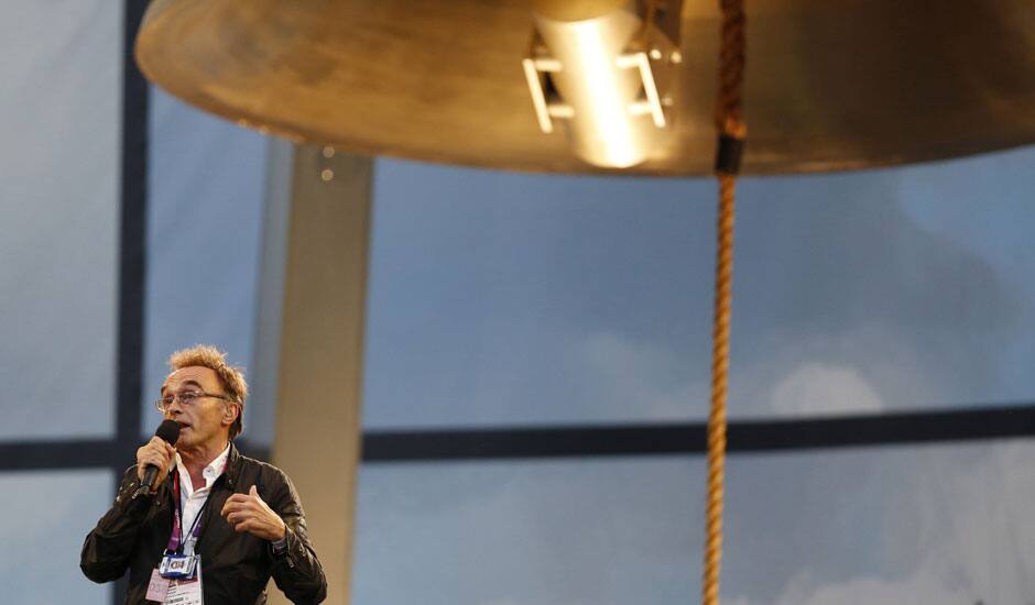 Opening Ceremony artistic director Danny Boyle speaks next to the Olympic Bell ahead of the Opening Ceremony at the 2012 Summer Olympics in London.