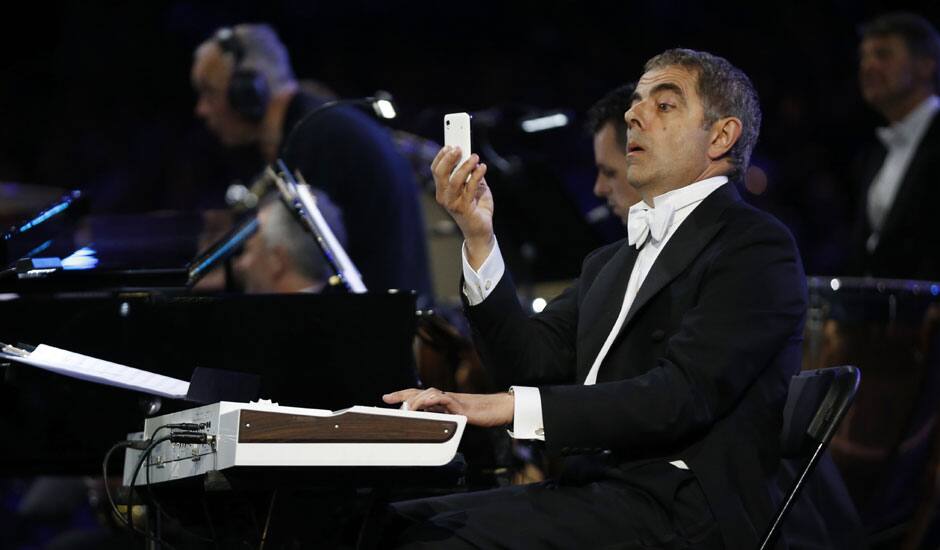 Actor Rowan Atkinson performs during the Opening Ceremony at the 2012 Summer Olympics in London.