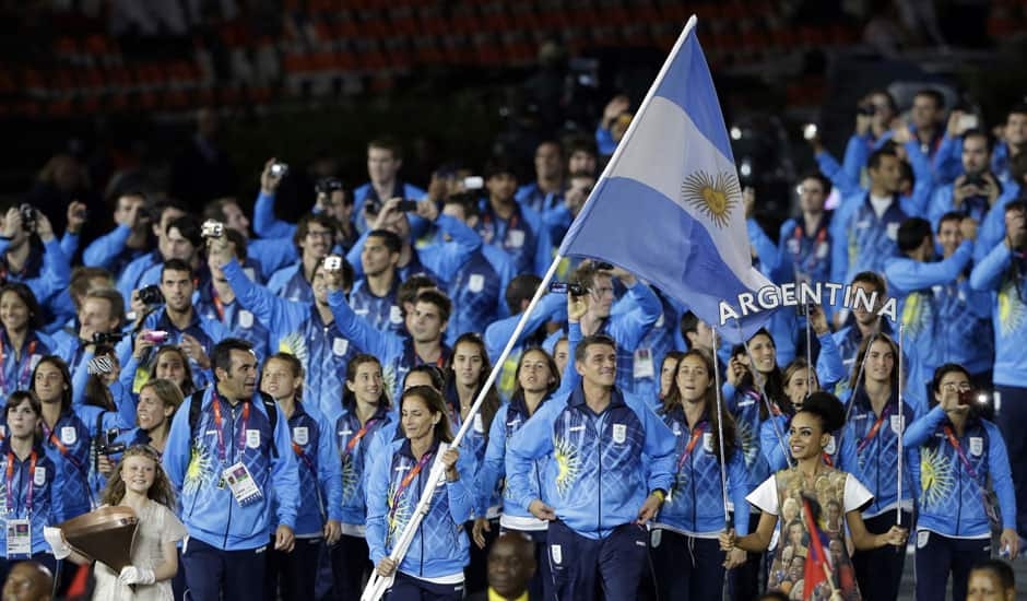 Argentina's Luciana Aymar carries her national flag during the Opening Ceremony at the 2012 Summer Olympics in London.