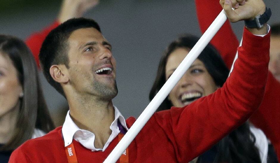 Serbia's Novak Djokovic carries the flag during the Opening Ceremony at the 2012 Summer Olympics in London.