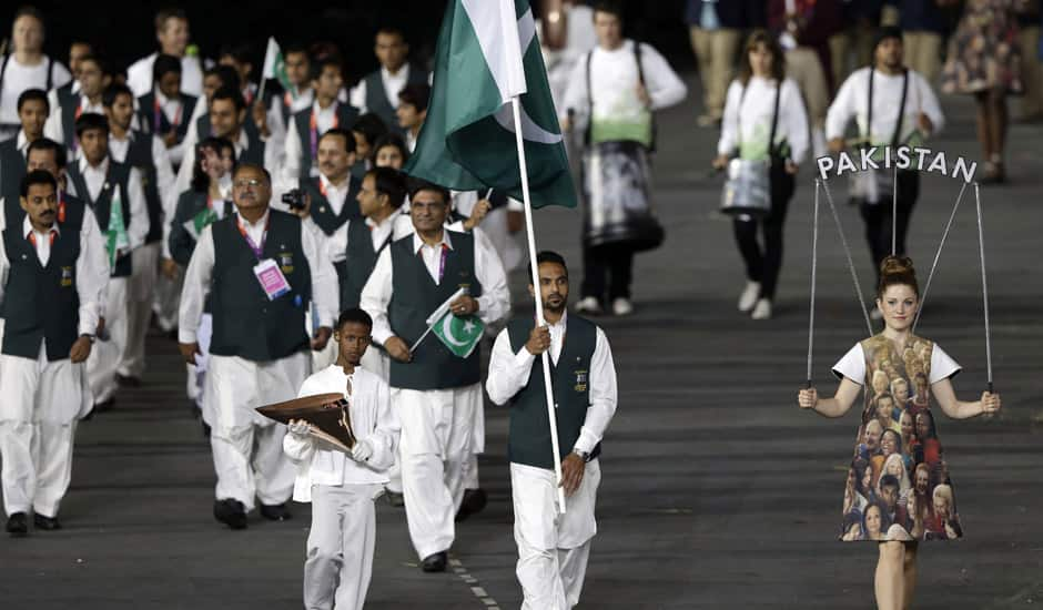 Pakistan's Sohail Abbas carries the flag during the Opening Ceremony at the 2012 Summer Olympics in London.