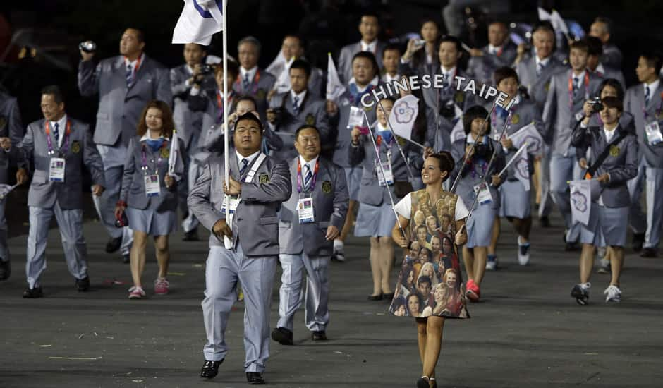 Taiwan's Chen Shih-chieh carries the national flag during the Opening Ceremony at the 2012 Summer Olympics in London.