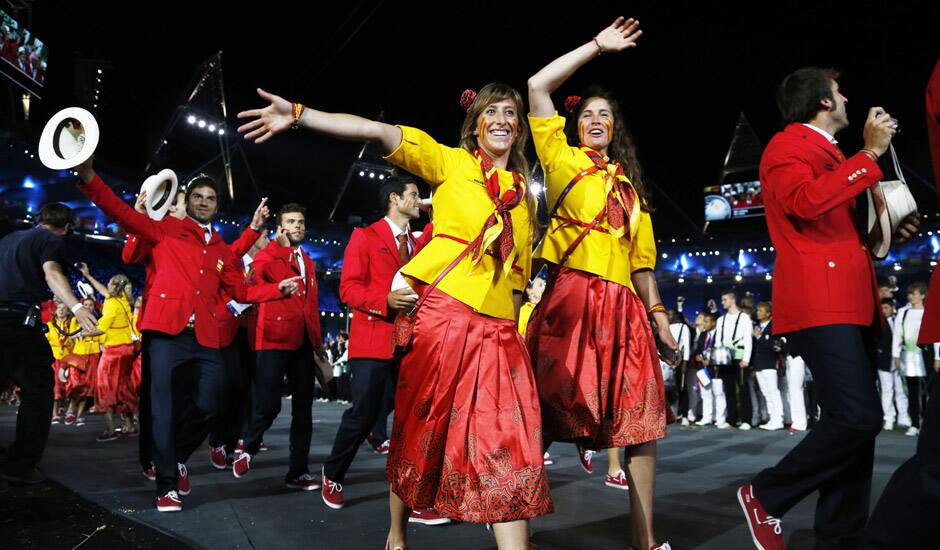 Athletes from Spain wave to spectators as they parade during the Opening Ceremony at the 2012 Summer Olympics in London. 