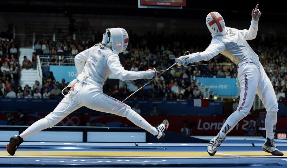 Natalia Sheppard of Great Britain, left and Sophie Troiano of Great Britain compete in the of round 64 during women's fencing at the 2012 Summer Olympics in London.