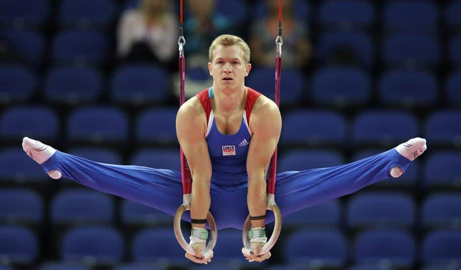 Czech gymnast Martin Konecny performs on the rings during the Artistic Gymnastic men's qualification at the 2012 Summer Olympics.