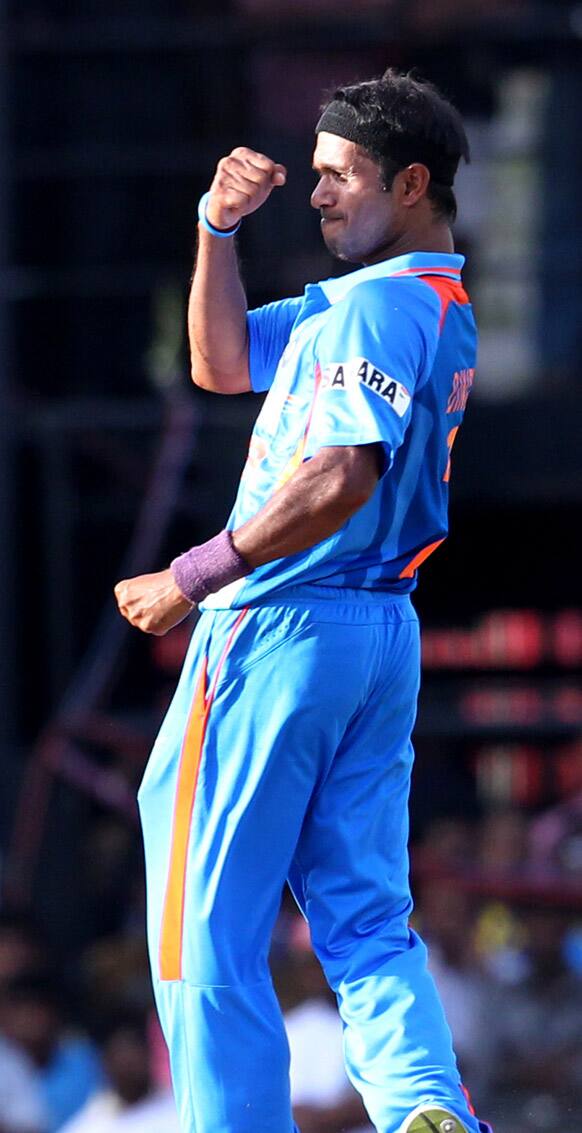 Ashok Dinda celebrates the dismissal of Sri Lanka's batsman Kumar Sangakkara during the third one-day international cricket match between India and Sri Lanka in Colombo.