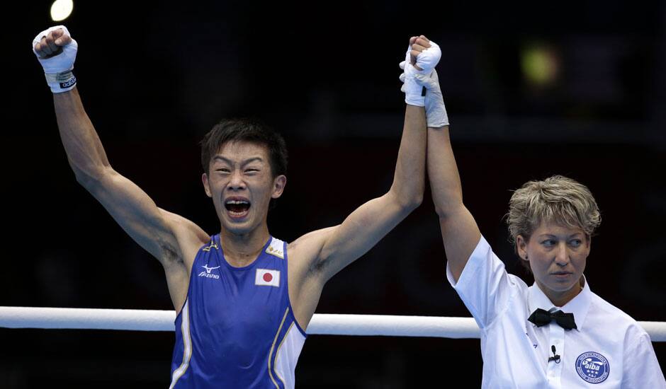 Japan's Satoshi Shimizu reacts after defeating Ghana's Isaac Dogboe in a bantam weight 56-kg preliminary boxing match at the 2012 Summer Olympics in London.