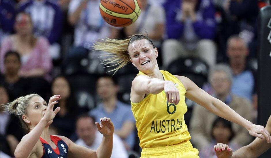 Australia's Jennifer Screen (6) passes the ball past Great Britain's Johannah Leedham (13)during the first half of a preliminary women's basketball game at the 2012 Summer Olympics in London.