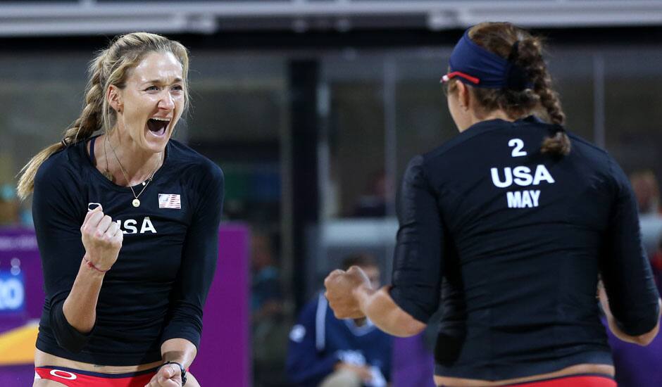 Misty May-Treanor, right, and Kerri Walsh, left, of US celebrate winning a point against Australia in their Beach Volleyball match at the 2012 Summer Olympics in London.