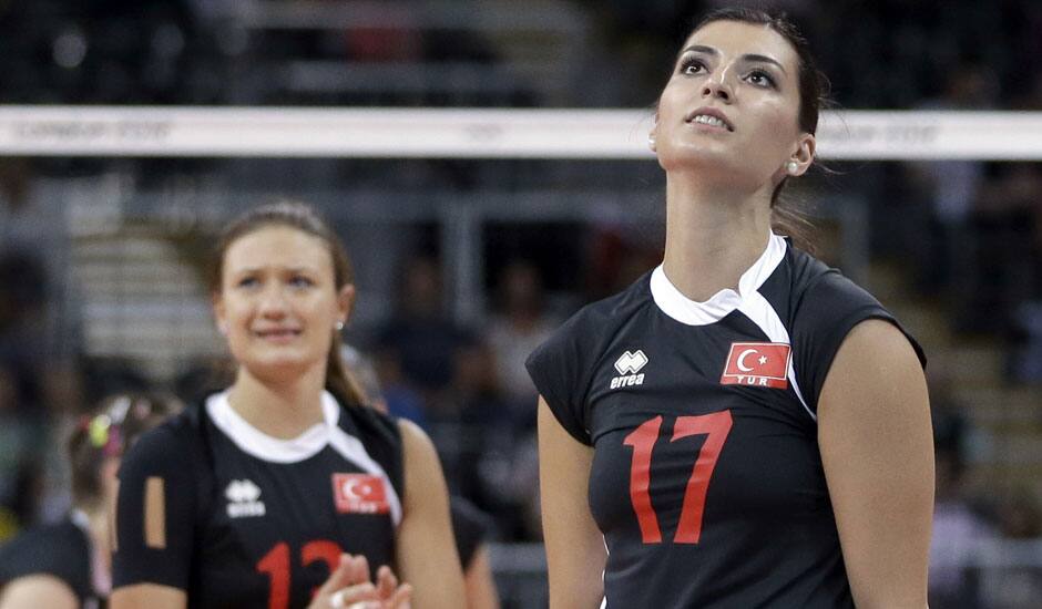 Turkey's Neslihan Darnel, right, reacts near teammate Neriman Ozsoy, left, after hitting the ball into the net on a serve during a women's preliminary volleyball match against Brazil at the 2012 Summer Olympics in London. 