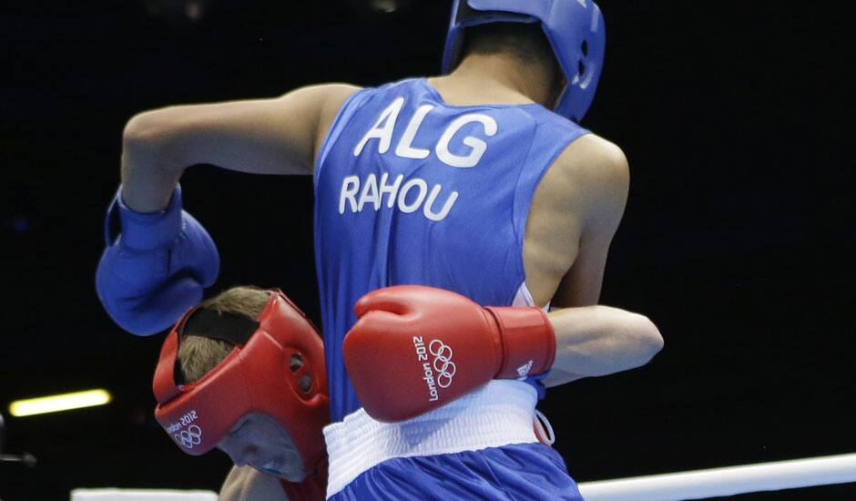 Australia's Jess Ross fights Algeria's Abelmalek Rahou, right, during a middle weight 75-kg preliminary boxing match at the 2012 Summer Olympics in London.