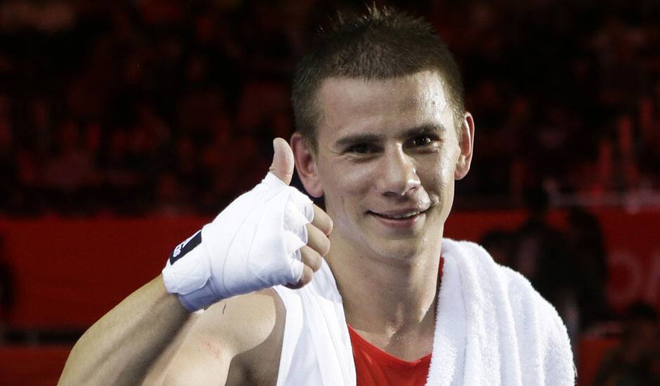 Serbia's Aleksandar Drenovak reacts after a middle weight 75-kg preliminary boxing match against Ecuador's Mario Delgado Suarez at the 2012 Summer Olympics in London.