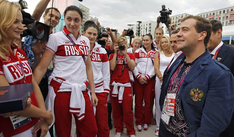 Russian Prime Minister Dmitry Medvedev, right, speaks with Russian Olympics team members during his visits to Olympic village at the 2012 Summer Olympics, in London.