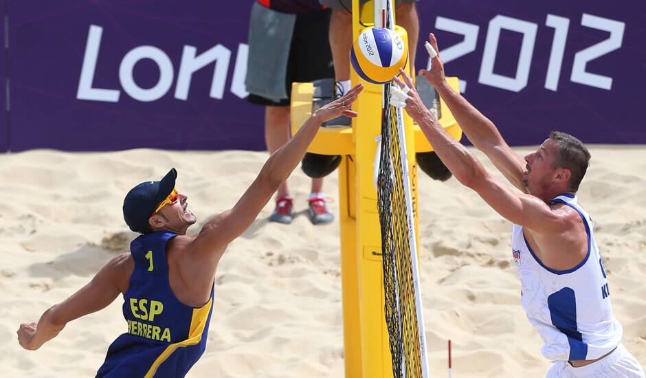 Pablo Allepuz Herrera, left, from Spain fights for a ball with Premysl Kubala, right, from Czech Republic during their Beach Volleyball match at the 2012 Summer Olympics in London.