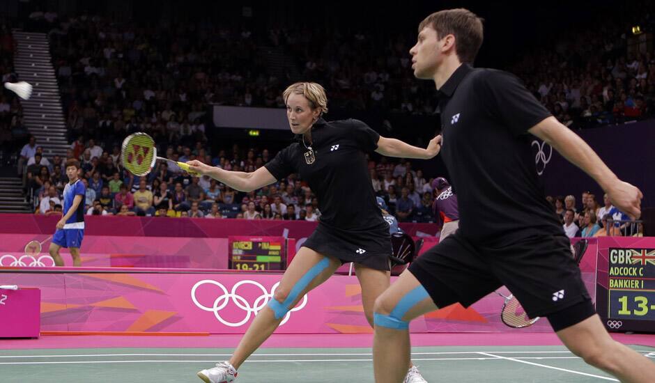 Germany's Birgit Michels, left, and Michael Fuchs play against Chris Adcock and Imogen Bankier of Great Britain during a mixed doubles badminton match at the 2012 Summer Olympics in London. 