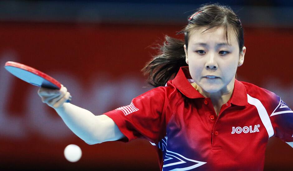 Ariel Hsing of the United States compets against Yifang Xian of France during the second round of women's table tennis at the 2012 Summer Olympics in London.