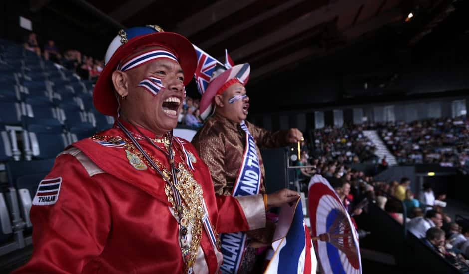 Thailand's supporters cheer for their team during a mixed doubles badminton match of the 2012 Summer Olympics in London.