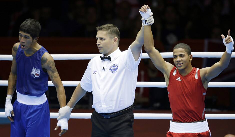 Puerto Rico's Felix Verdejo Sanchez,  reacts after beating Panama's Juan Huertes Garcia, during their men's light 60-kg boxing match at the 2012 Summer Olympics in London.