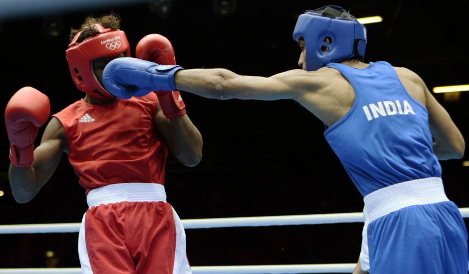 India's Bhagwan Jai, right, connects with Andrique Allisop of the Seychelles, during men's light 60-kg boxing at the 2012 Summer Olympics.