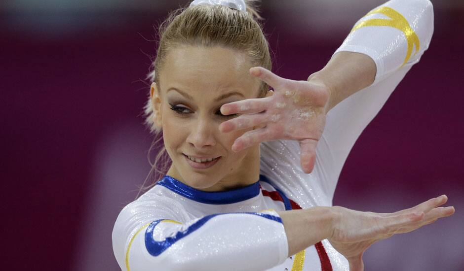 The hand of Romania's gymnast Sandra Raluca Izbasa show calluses as she performs on the floor during the Artistic Gymnastics women's qualification at the 2012 Summer Olympics.